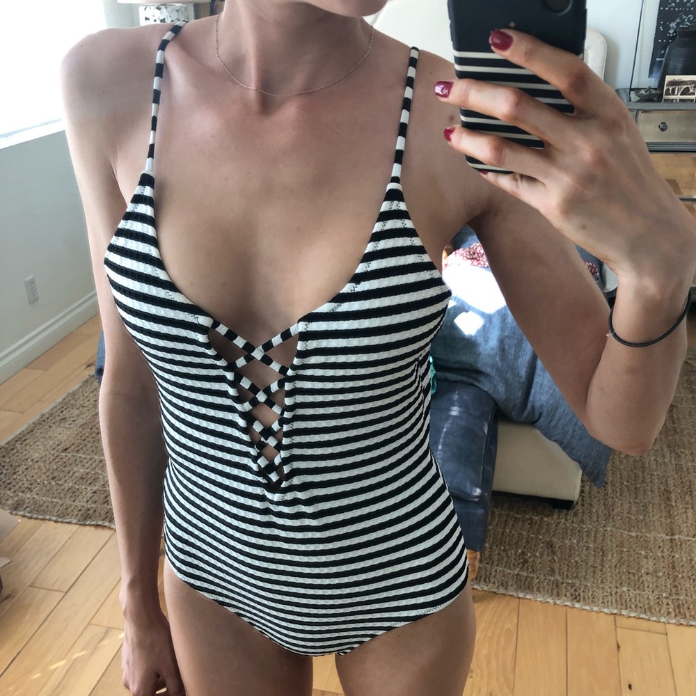 Black and white striped billabong one piece suit